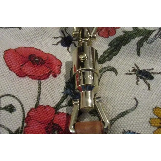 RARE, Gucci, unique, flora design fabric and nude leather, 1961 Jackie hobo style purse with vibrant colors, a gold piston closure